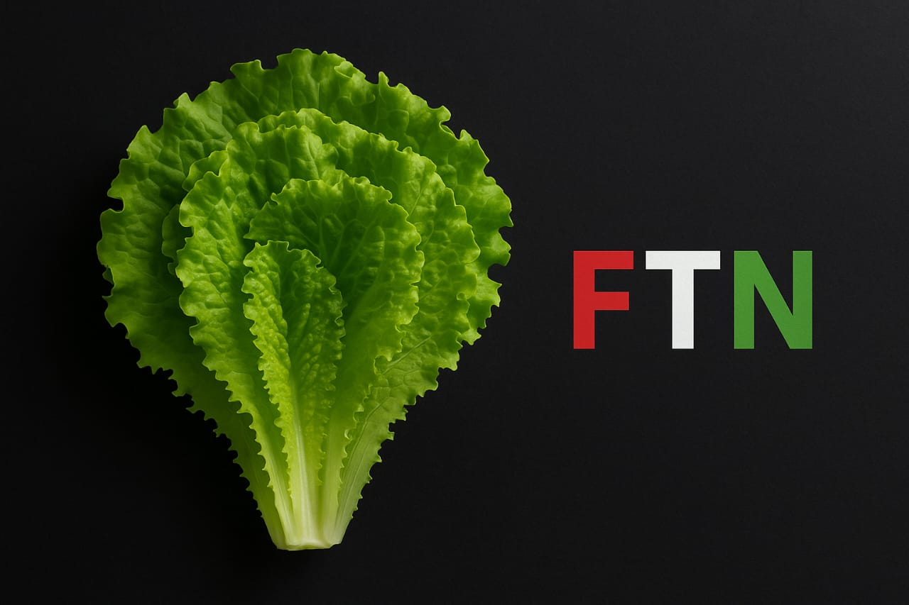 Fresh green lettuce on a dark background with FTN logo — F in red, T in white, and N in green — symbolizing hydration, fiber, and essential vitamins for athletes.